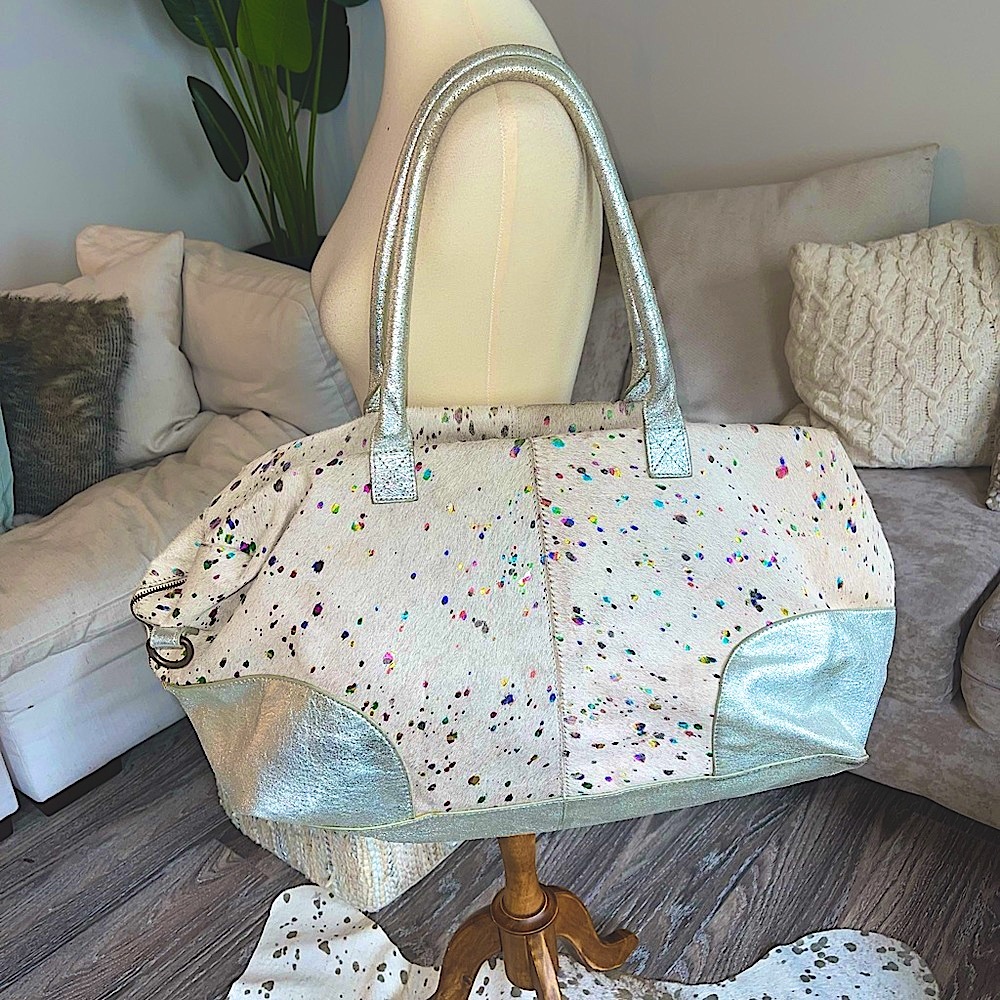 Free People Weekender calf hair bag with metallic rainbow splatters